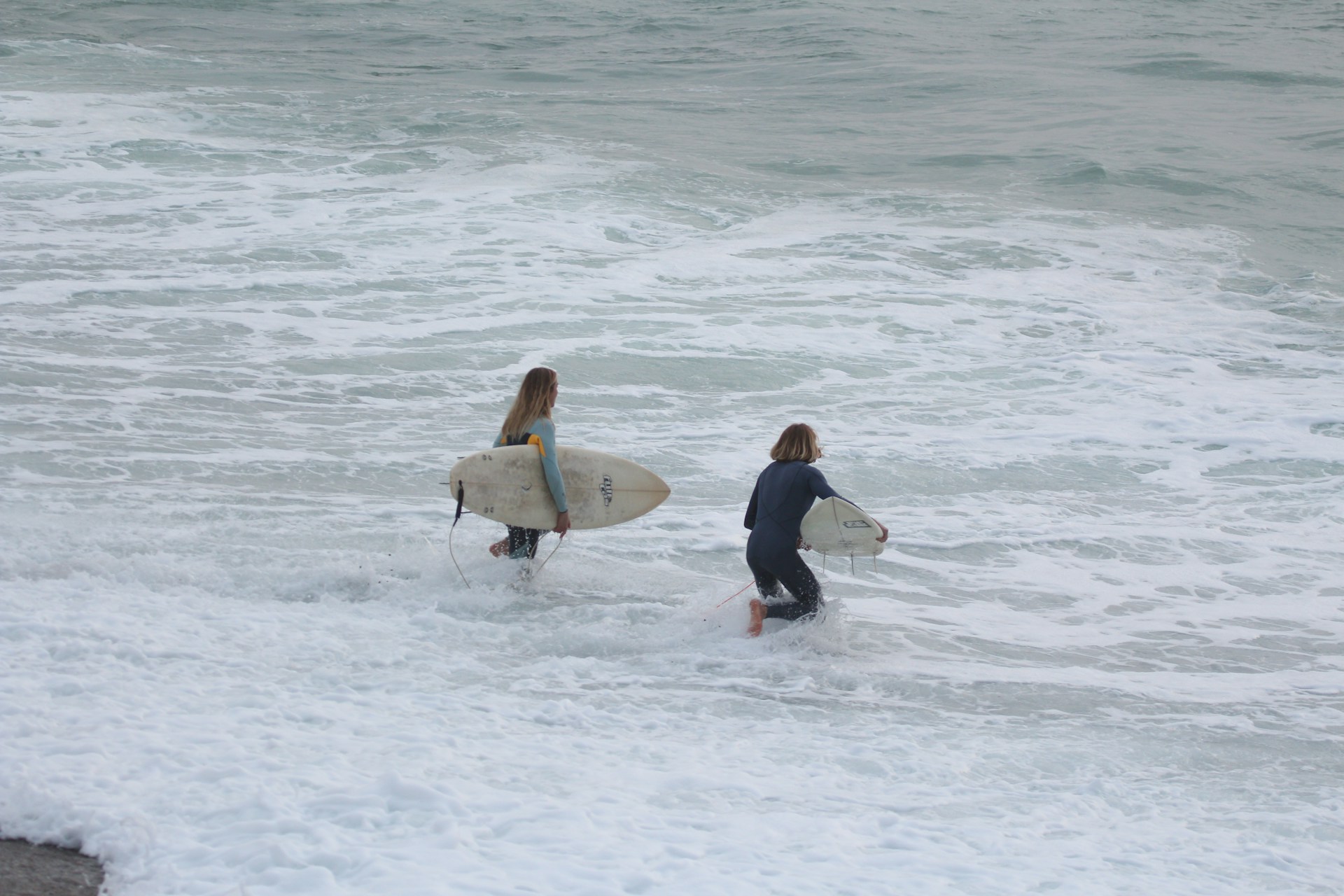 People surfing in the rain
