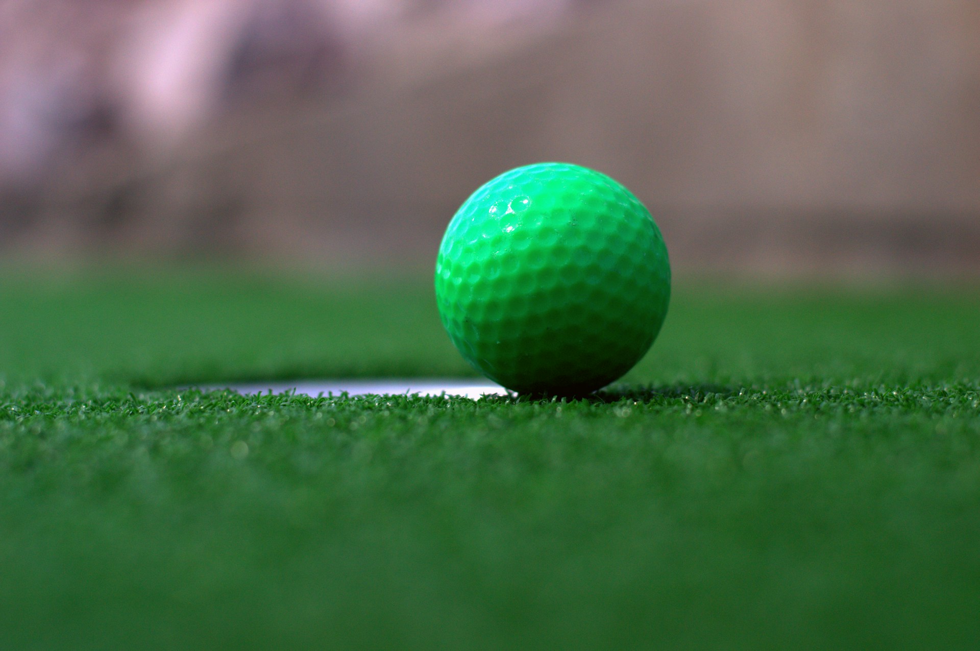 a green minigolf ball