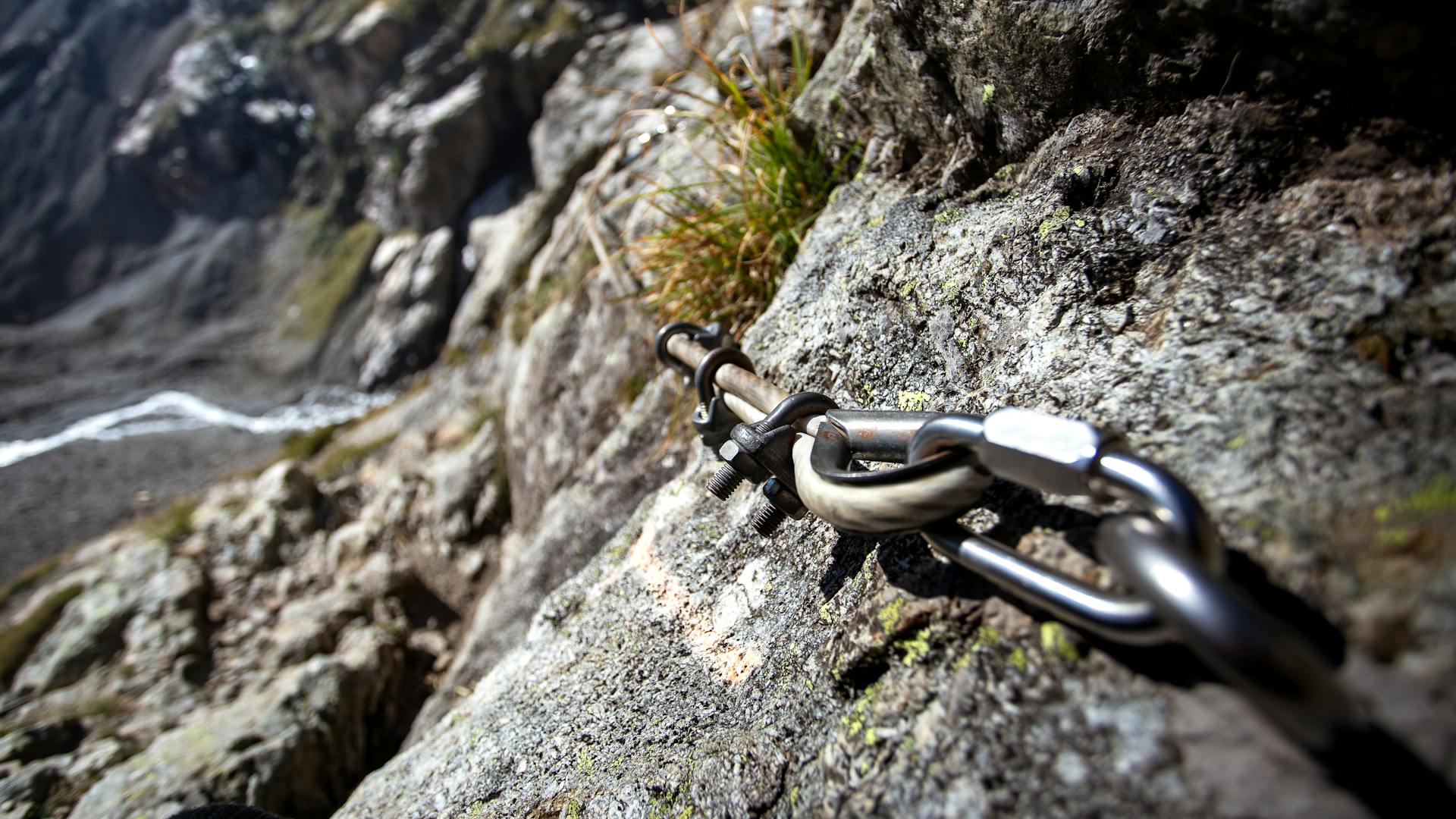 via ferrata safety ropes on the side of a cliff