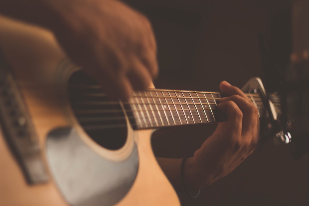 A musician playing a guitar 
