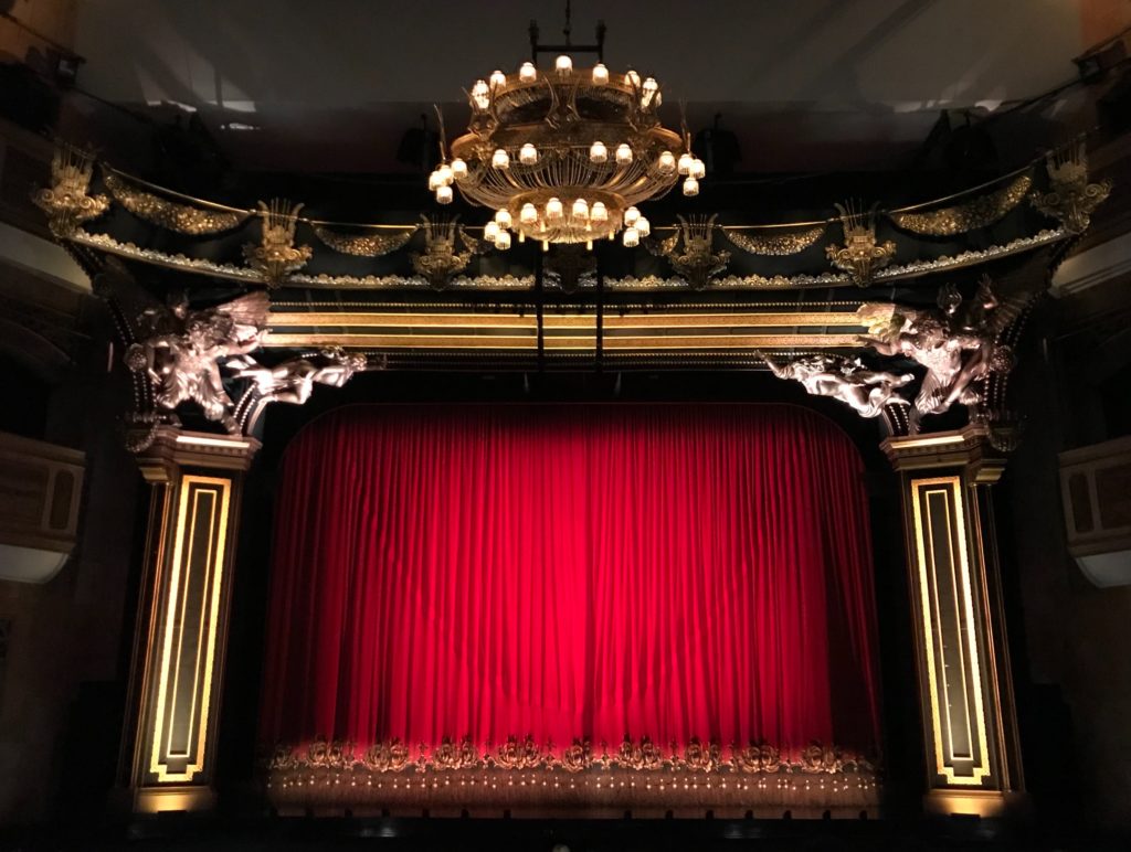 Theatre stage and red curtains
